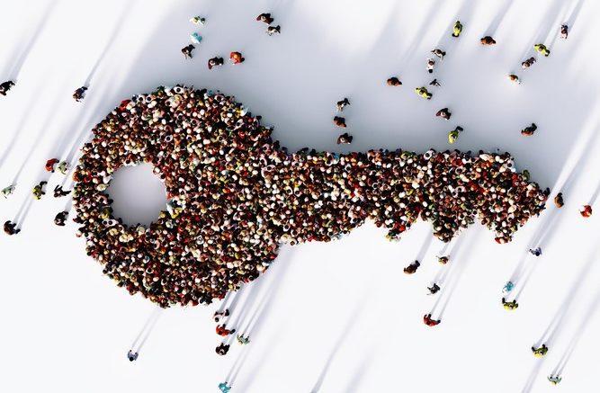 Human crowd forming a big key icon on white background.