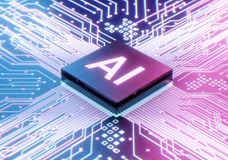 AI text on a microchip centered on a motherboard.