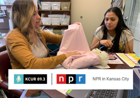 Nuture KC staff showing how to swaddle a baby.