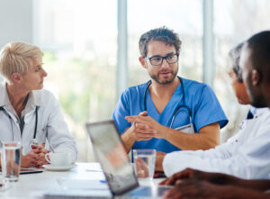 Clinicians conducting a meeting.