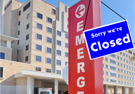 Hospital with a closed sign at entrance.