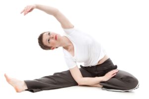 A woman practicing yoga.