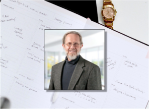 A daily planner, wrist watch, and picture of Terry Rosell.