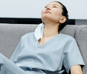 Nurse resting on a sofa.