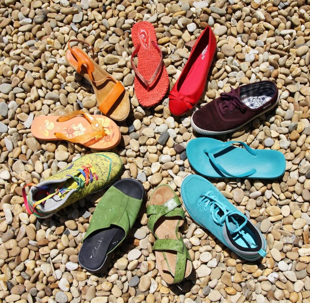 Different color and kinds of shoes in a circle to represent diversity.