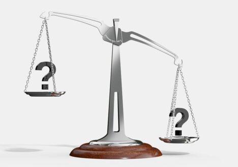 A scale weighing 2 question marks.