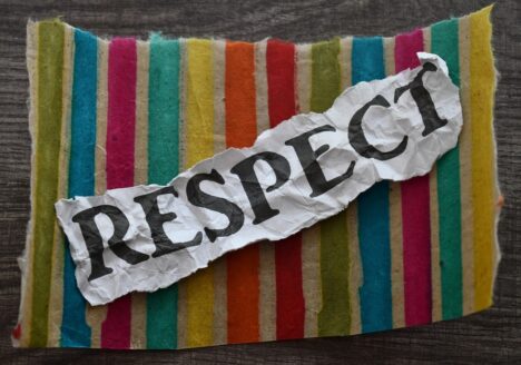 The word respect on multicolored material.