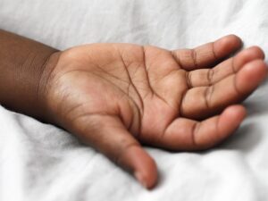 A child's hand laying open.